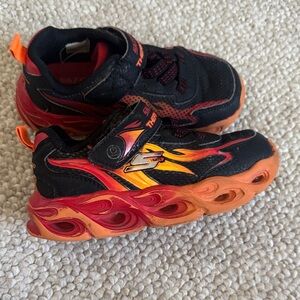 Skechers Kids Black Sneakers with Red and Orange Flame Accents